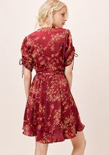 [Color: Burgundy] Ultra feminine floral mini wrap dress. A soft and silky wrap dress features a tie sleeve detail and a flattering v neckline. 