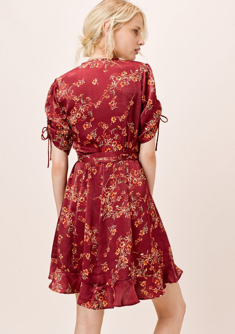 [Color: Burgundy] Ultra feminine floral mini wrap dress. A soft and silky wrap dress features a tie sleeve detail and a flattering v neckline. 