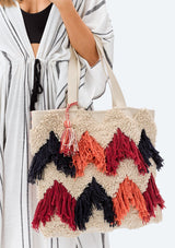 [Color: Multi] Lovestitch fringed, zig-zag tote bag with hanging tassel detail. Striped, multi patterned design on back of tote.