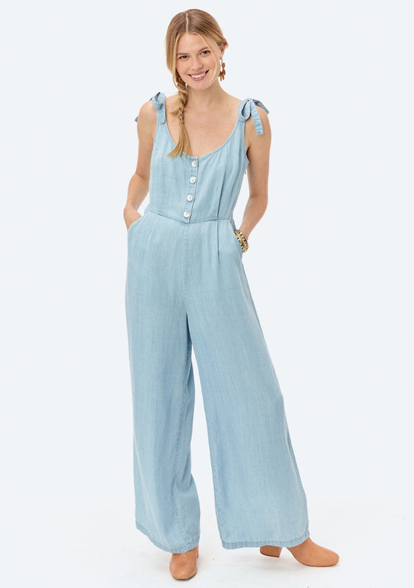 [Color: Heritage Blue] Lovestitch light blue, wide-leg, sleeveless, tencel jumpsuit with tie shoulder detail and buttoned top.