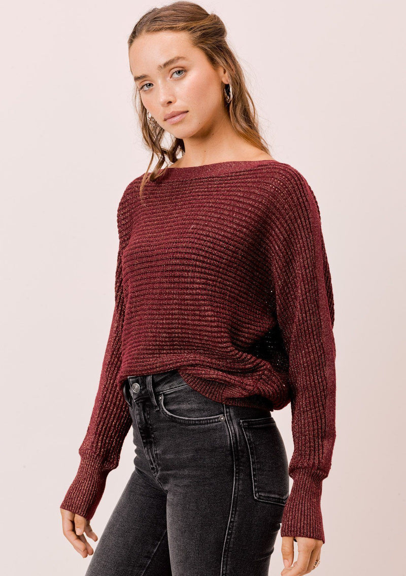 [Color: Merlot/Gold] A sparkly and sophisticated bateau neck sweater featuring open stitch details and flattering dolman sleeves. The subtle metallic detail catches the light as you move.