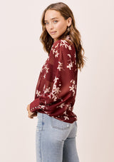 [Color: Brick/Rosewater] A versatile floral chiffon top, featuring long dolman sleeves and a billowy silhouette. Shown here with a camisole underneath.