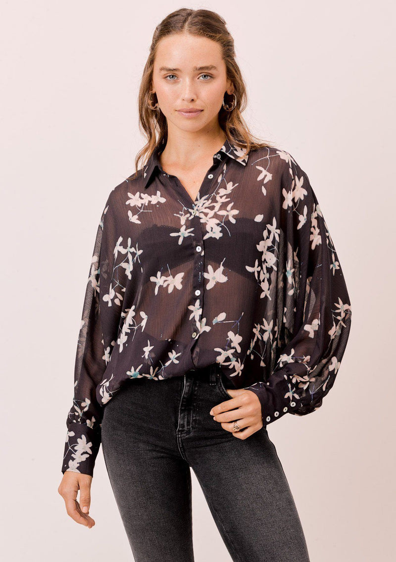 [Color: Midnight/Champagne] A versatile floral chiffon top, featuring long dolman sleeves and a billowy silhouette. Shown here with a camisole underneath.