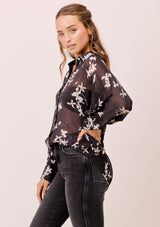 [Color: Midnight/Champagne] A versatile floral chiffon top, featuring long dolman sleeves and a billowy silhouette. Shown here with a camisole underneath.
