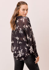 [Color: Midnight/Champagne] A versatile floral chiffon top, featuring long dolman sleeves and a billowy silhouette. Shown here with a camisole underneath.