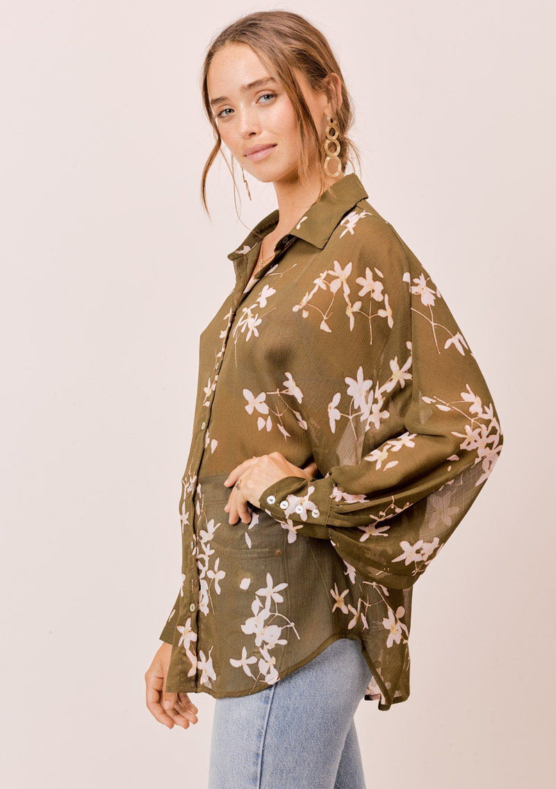 [Color: Olive/Rosewater] A versatile floral chiffon top, featuring long dolman sleeves and a billowy silhouette. Shown here with a camisole underneath.