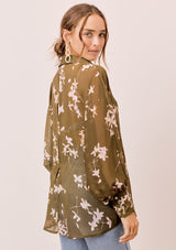 [Color: Olive/Rosewater] A versatile floral chiffon top, featuring long dolman sleeves and a billowy silhouette. Shown here with a camisole underneath.