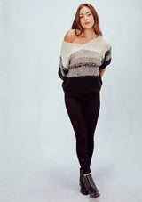 [Color: Grey] Striped cropped sweater tee. Featuring a flattering deep v neckline, a trendy cropped length, and elbow length sleeves. The soft neutral toned stripes add a bohemian touch.