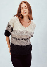 [Color: Grey] Striped cropped sweater tee. Featuring a flattering deep v neckline, a trendy cropped length, and elbow length sleeves. The soft neutral toned stripes add a bohemian touch.