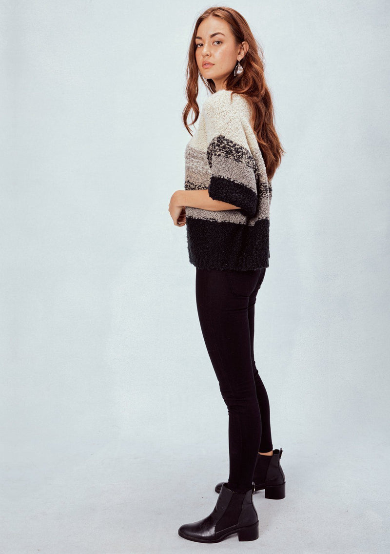 [Color: Grey] Striped cropped sweater tee. Featuring a flattering deep v neckline, a trendy cropped length, and elbow length sleeves. The soft neutral toned stripes add a bohemian touch.