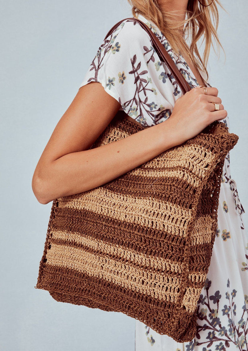 [Color: Teak/Saddle] Lovestitch light brown & dark brown striped, straw tote bag with vegan leather handles.