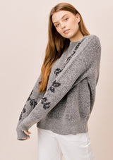 [Color: HeatherGrey/Midnight] Lovestitch heathergrey/midnight long sleeve, crew neck sweater with ribbed details and metallic floral jacquard design.
