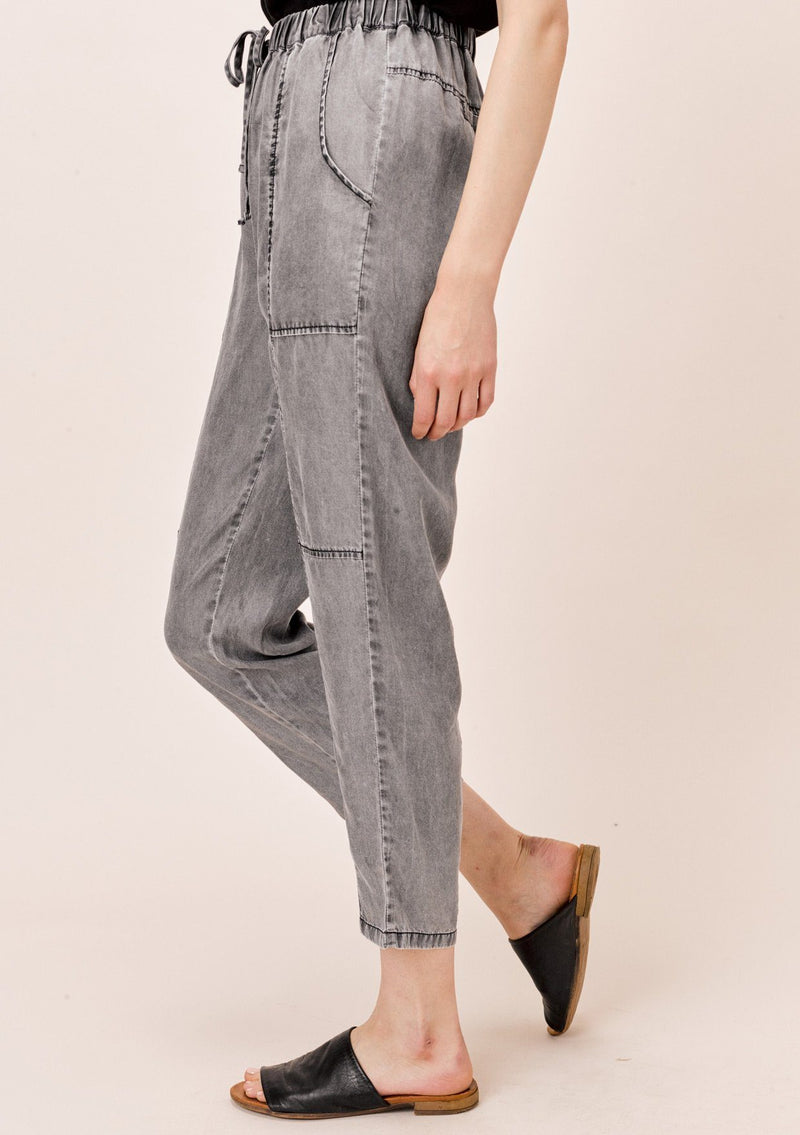 [Color: Acid Black] Lovestitch acid indigo wash jogger pant with seamed detail and elastic drawstring waist.