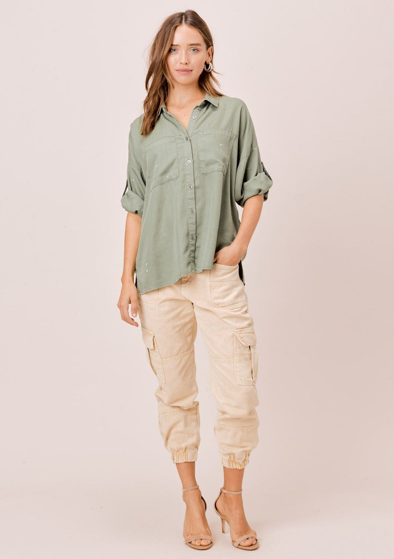 [Color: Olive] Lovestitch olive short sleeve, tencel, buttondown shirt with roll tab sleeves and paint splatter detail. 