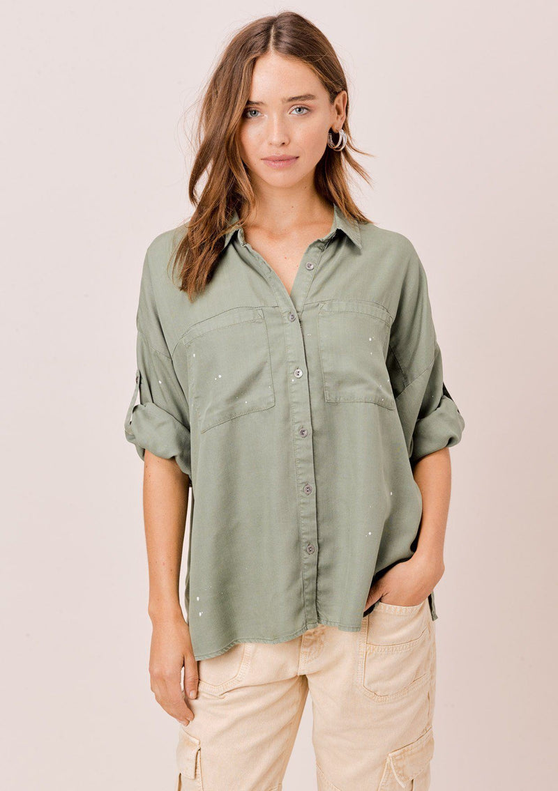 [Color: Olive] Lovestitch olive short sleeve, tencel, buttondown shirt with roll tab sleeves and paint splatter detail. 