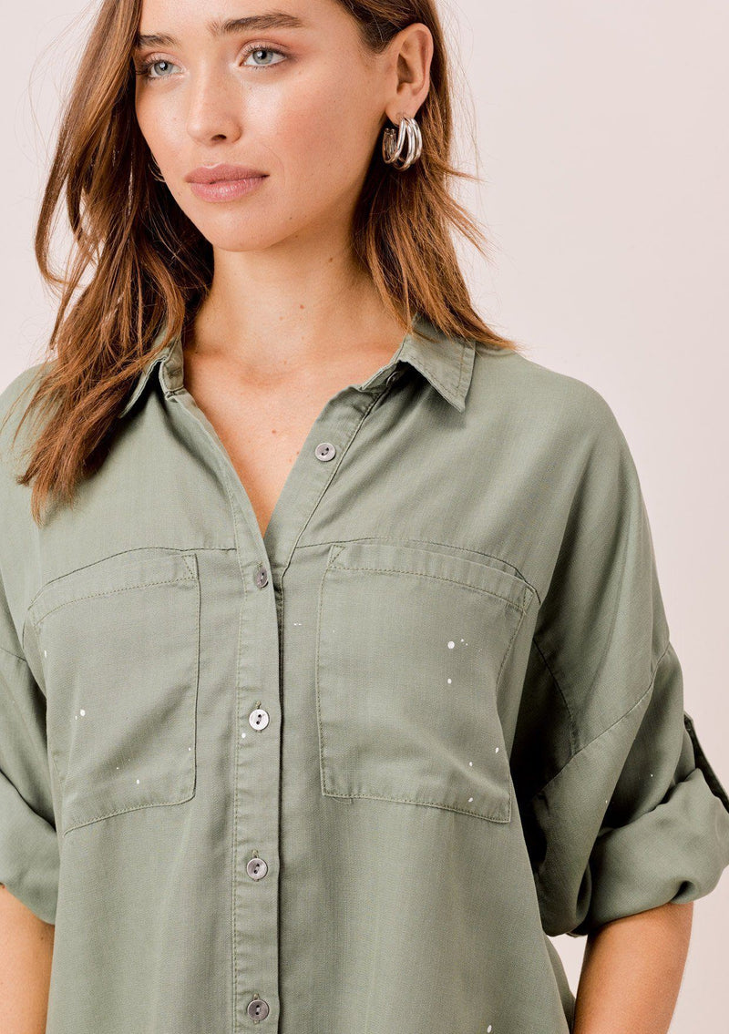[Color: Olive] Lovestitch olive short sleeve, tencel, buttondown shirt with roll tab sleeves and paint splatter detail. 