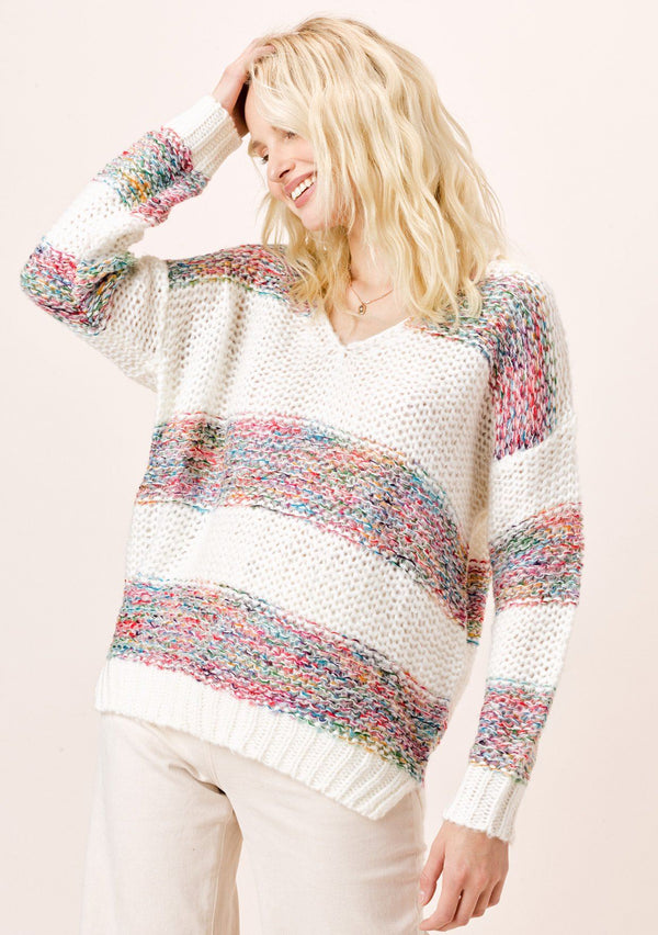 [Color: OffWhite/Multi] Lighten up your day and stay cozy in this beautiful loose knit white sweater with multi color rainbow yarn stripes, featuring a cute v neckline and ribbed hem. It is a spring and summer closet staple for breezy days.