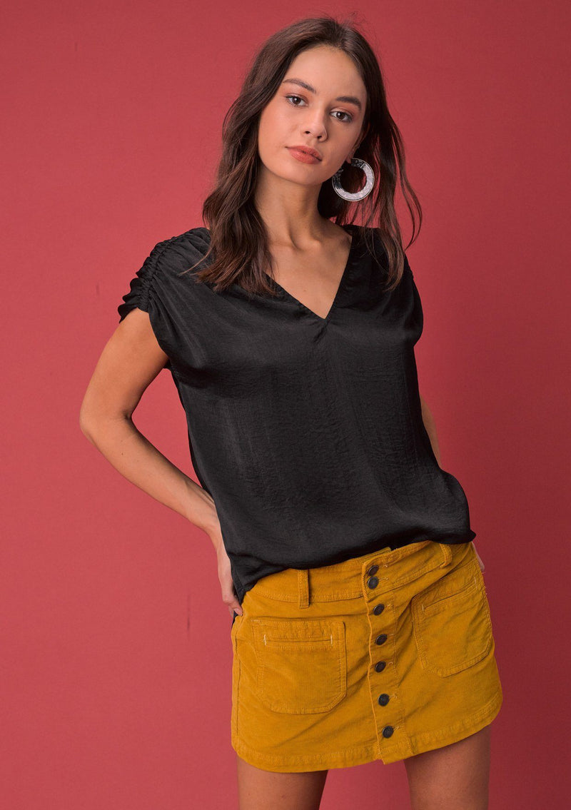 [Color: Black] A washed satin top, featuring a flattering gathered short sleeve detail, a plunging v neckline and gathered details along the back yoke. 