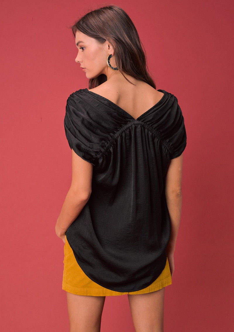 [Color: Black] A washed satin top, featuring a flattering gathered short sleeve detail, a plunging v neckline and gathered details along the back yoke. 