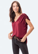 [Color: Black] A washed satin top, featuring a flattering gathered short sleeve detail, a plunging v neckline and gathered details along the back yoke. 