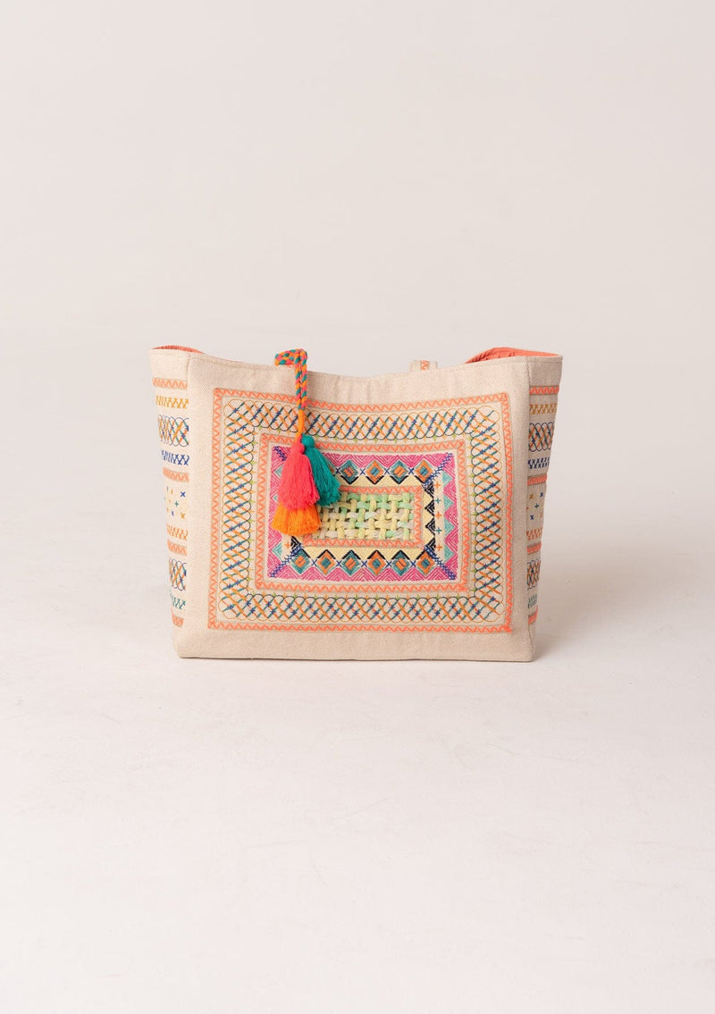 [Color: Natural/Neon Coral] A bohemian large tote bag with center lattice detail, embroidery, extra large tassel accent, and two straps. With a magnetic closure. 