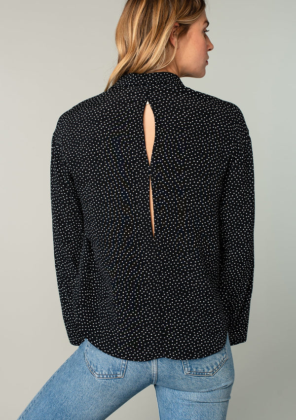 [Color: Black/Ivory] A flowy black and white collared button down top.