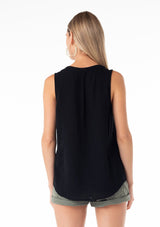 [Color: Black] A back facing image of a blonde model wearing a bohemian black cotton tank top with a split v neckline, embroidered trim, and a relaxed fit. 
