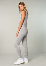 [Color: Dark Heather Grey] Girl wearing a cozy knit sleeveless lounge jumpsuit.