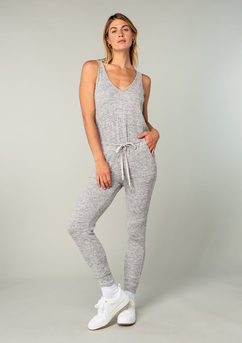 [Color: Dark Heather Grey] Girl wearing a cozy knit sleeveless lounge jumpsuit.