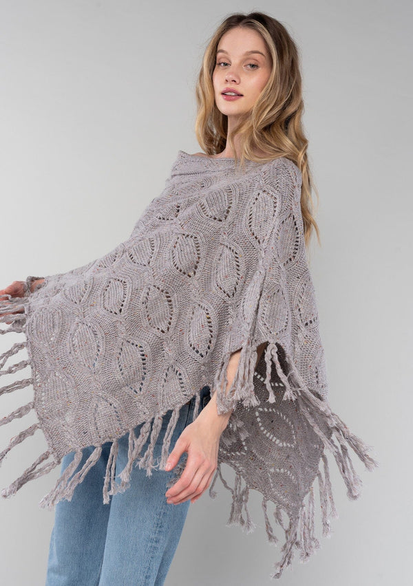 [Color: Grey/Rust] A vintage inspired sweater poncho knit from a grey speckled yarn. With a fringed hemline. 
