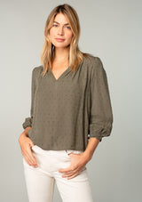 [Color: Olive] A half body front facing image of a blonde model wearing an olive green classic bohemian peasant top with voluminous lace trimmed long sleeves.