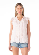 [Color: Light Pink] A front facing image of a blonde model wearing a light pink cotton textured gingham top. With short flutter cap sleeves, a self covered button front, a tassel tie neckline, and lace trim.