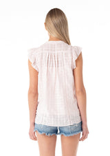 [Color: Light Pink] A back facing image of a blonde model wearing a light pink cotton textured gingham top. With short flutter cap sleeves, a self covered button front, a tassel tie neckline, and lace trim.