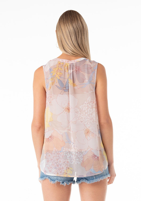 [Color: Natural/Blue] A back facing image of a blonde model wearing a pretty spring chiffon tank top designed in a pink and blue floral print. With a self covered button front, a button loop trimmed split v neckline, and a relaxed fit. 