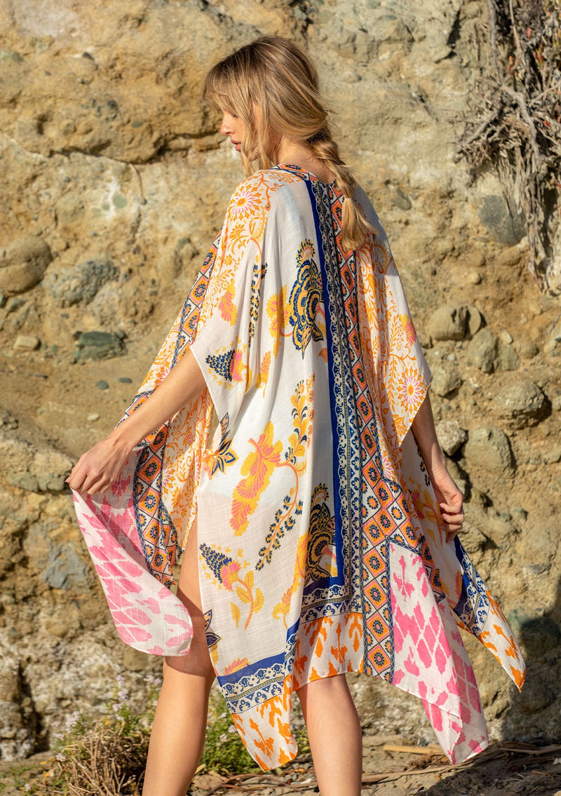 [Color: Sunkist/Off White] A model wearing a blue and yellow mixed bohemian print kimono.