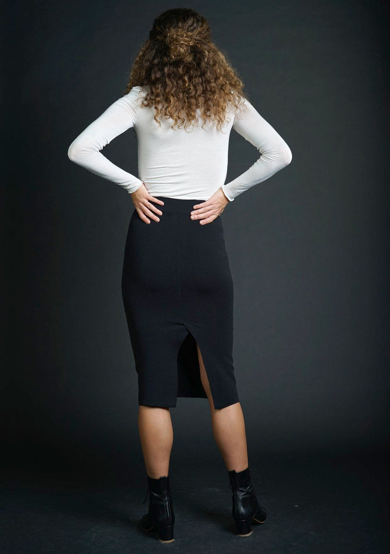 [Color: Black] Lovestitch black, fitted, micro ribbed pencil skirt features a high contoured waist and back slit detail.