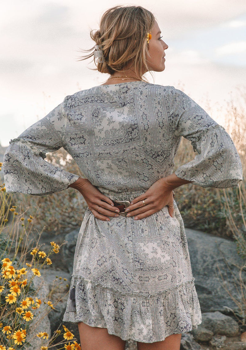 [Color: Lav.Grey/Ivory] Vintage inspired light blue classic bohemian paisley wrap dress with a deep V-neckline and volume ruffle sleeves and hem.