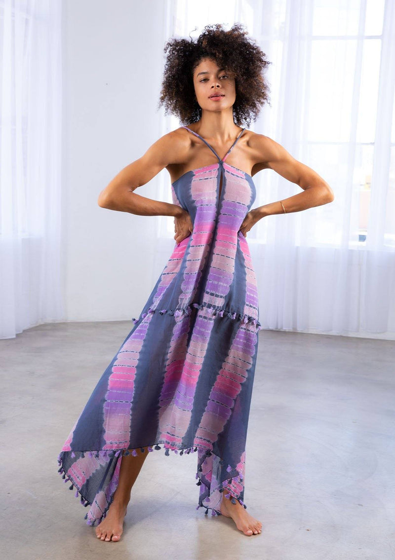 [Color: Grey/Purple] A model wearing a sheer cotton tie dye scarf dress. With a handkerchief hemline, front keyhole detail, and sexy adjustable strappy back.