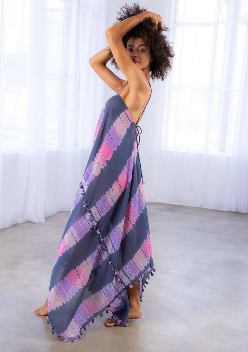 [Color: Grey/Purple] A model wearing a sheer cotton tie dye scarf dress. With a handkerchief hemline, front keyhole detail, and sexy adjustable strappy back.