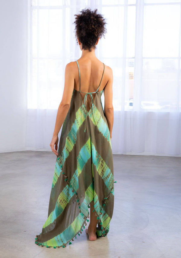 [Color: Olive/Khaki] A model wearing a sheer cotton tie dye scarf dress. With a handkerchief hemline, front keyhole detail, and sexy adjustable strappy back.