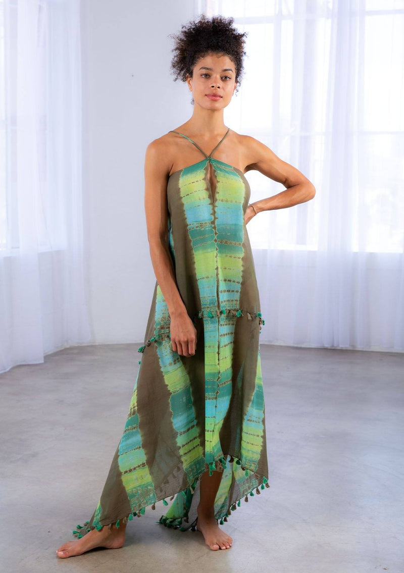 [Color: Olive/Khaki] A model wearing a sheer cotton tie dye scarf dress. With a handkerchief hemline, front keyhole detail, and sexy adjustable strappy back.