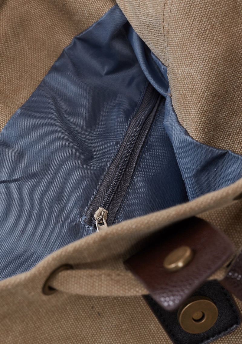[Color: Beige] A detail image of cotton blend beige sack backpack with a drawstring closure. 