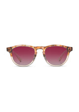 [Color: Low Tide] Sunglasses with a deep pink lens and a rose flower inlay. 